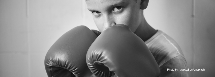 Young boy with boxing gloves