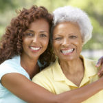 Senior Woman With Adult Daughter In Park